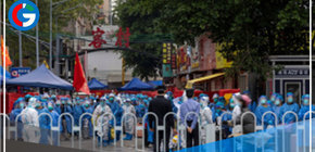 Guangzhou, centro manufacturero de China, confina a millones de personas mientras se extiende un brote de covid-19